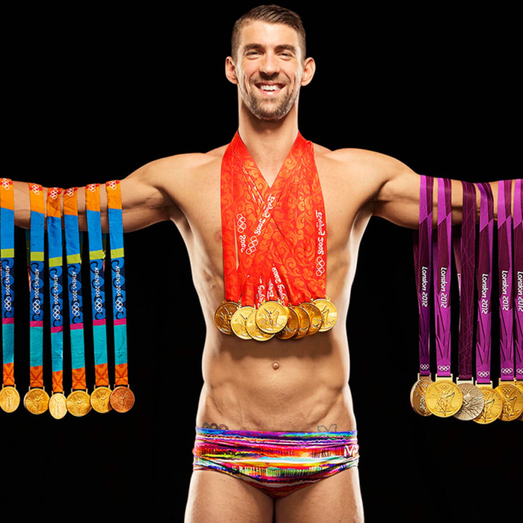 Michael Phelps wearing his Olympic medals