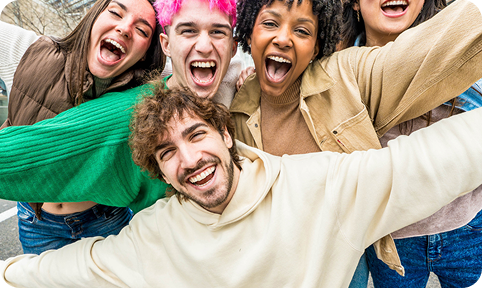 Group of friends happily posing for the camera