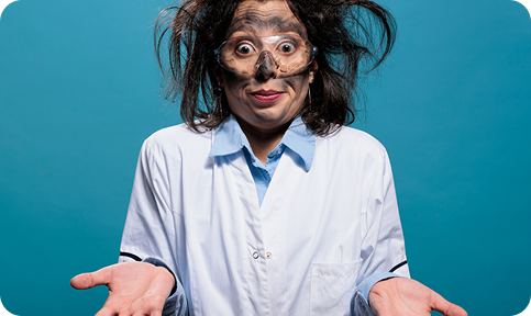 Woman with frizzy hair and facial coal mask looking overwhelmed