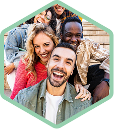 Group selfie of people smiling at the camera